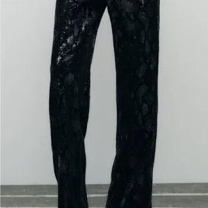 Zara Black Straight Leg Pants with Shiny Texture and Flared Design